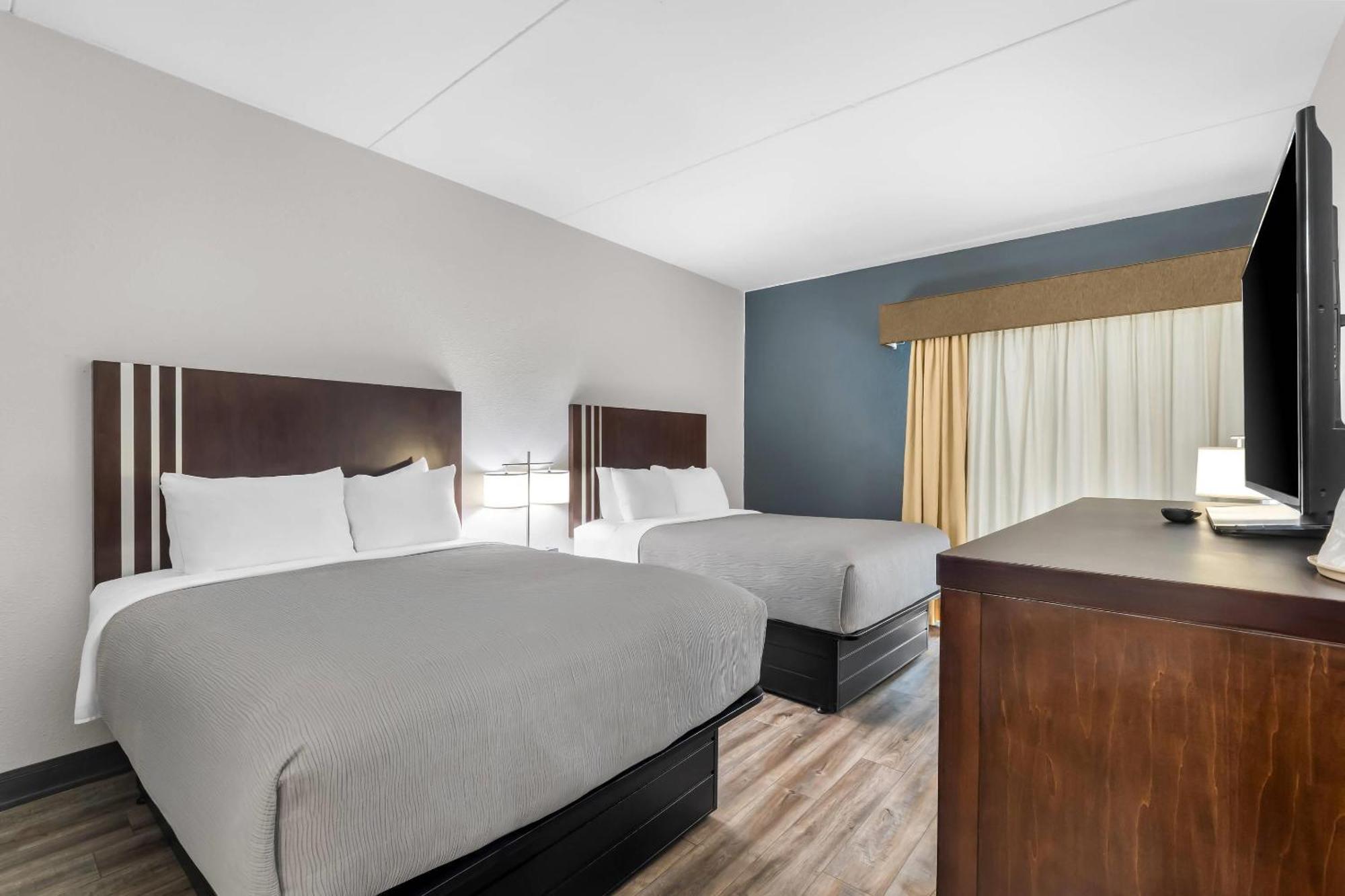 Quadruple Room Two Queen Beds Non Smoking or Interior Corridor